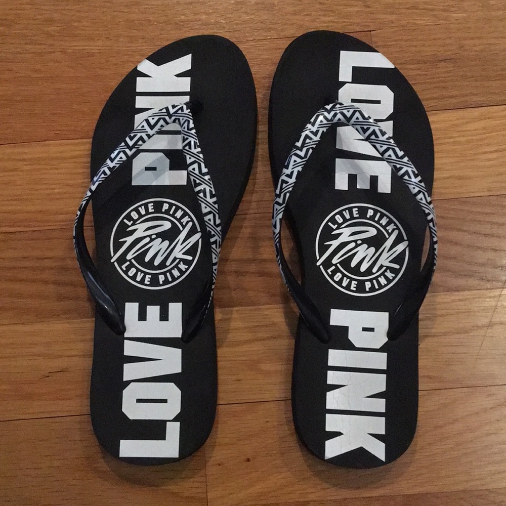 Pink, black and white flip flops, worn once.